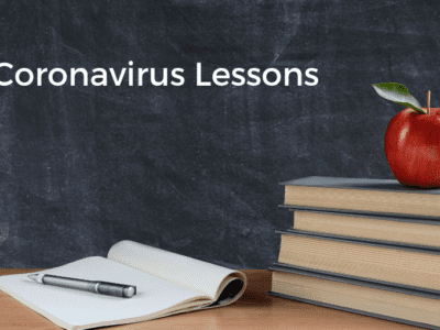 Photo of school books, notepad and apple with "Coronavirus lessons" typed on chalkboard.