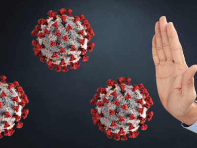 Illustration of a virus particles and hand held up to express "stop."
