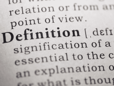 Photo of the word "definition" in a dictionary.